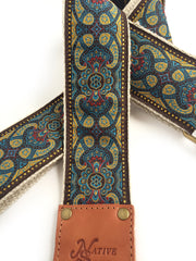 Native Sons Goods vintage style guitar strap with intricate blue and gold pattern and leather ends